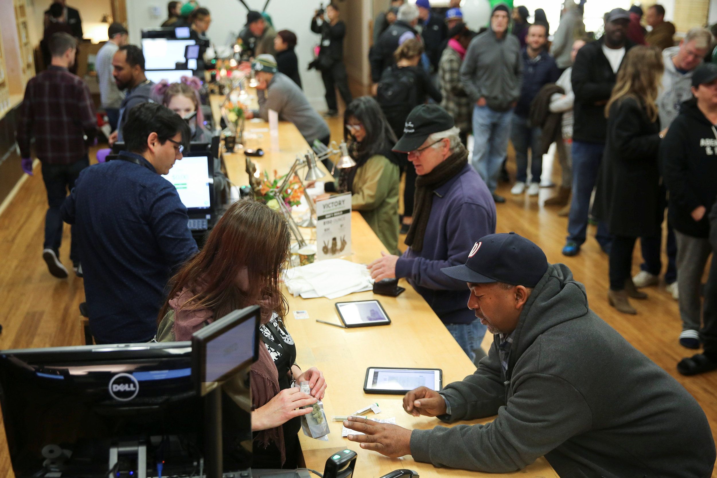 Customers Checkout Out At Dispensary